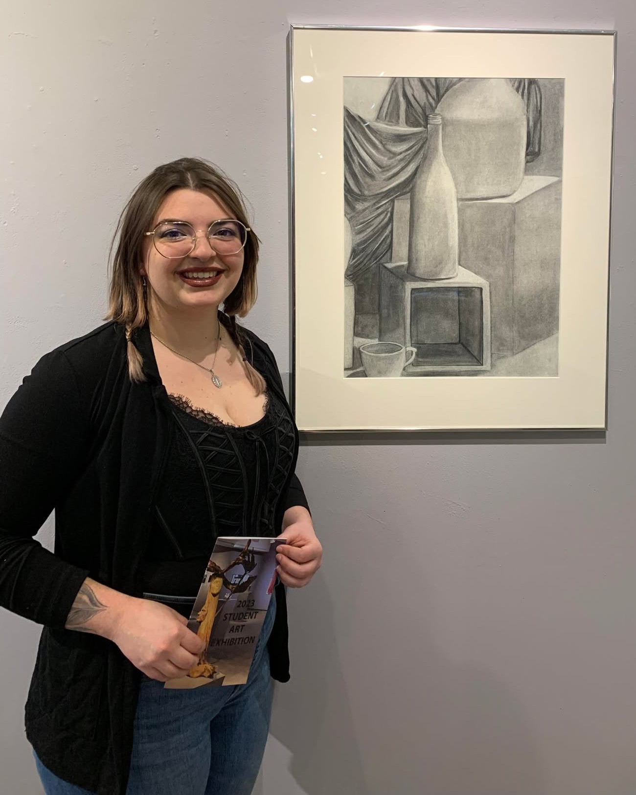 Picture of self in front of a piece of my work